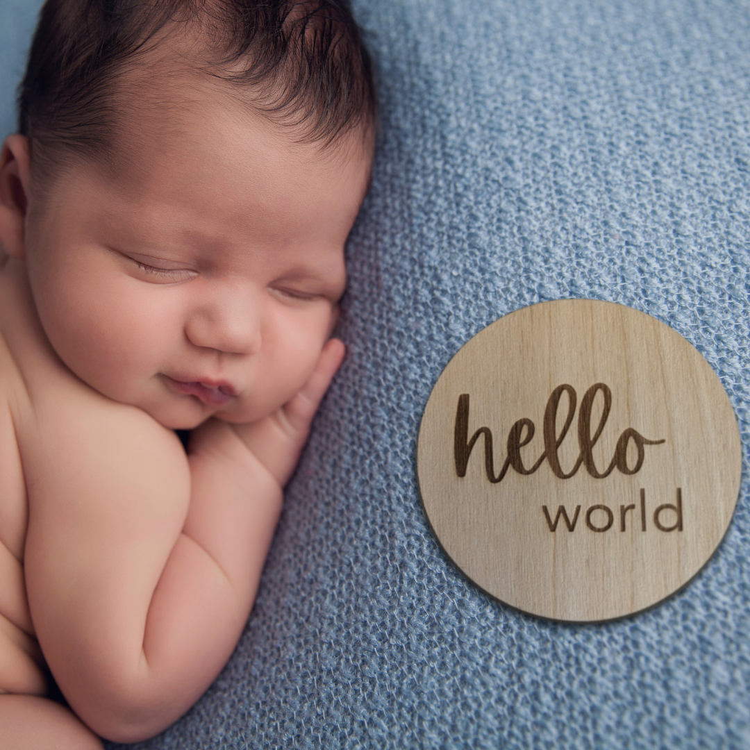 Baby with Hello World Disc