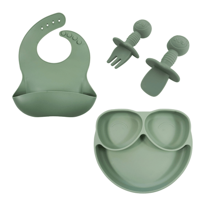 Sage silicone plate, bib and utensils.